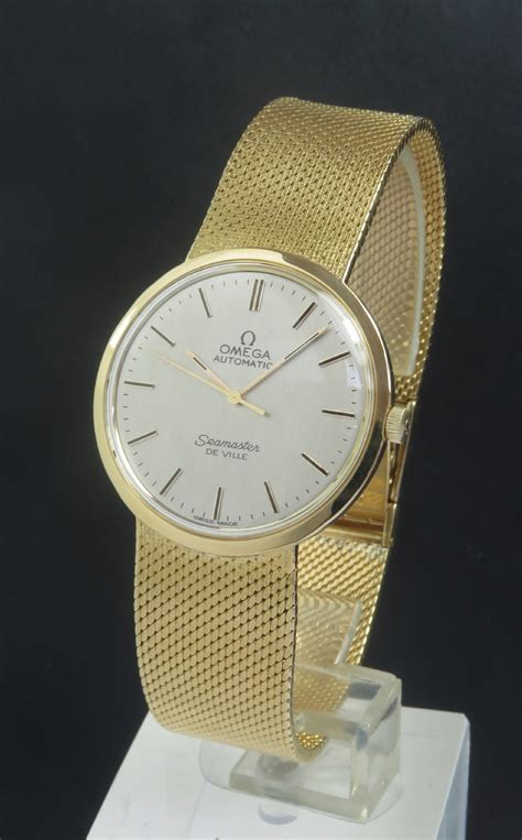 solid gold mens omega watch